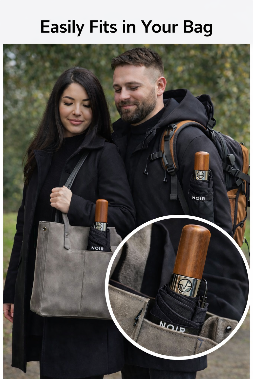 Man and woman holding a black umbrella with wooden handle, close-up of umbrella in pocket.